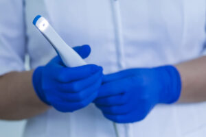 Image of hands holding an intraoral camera