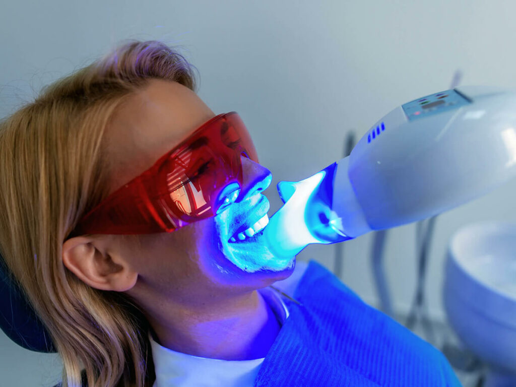 Image of a woman getting her teeth whitened